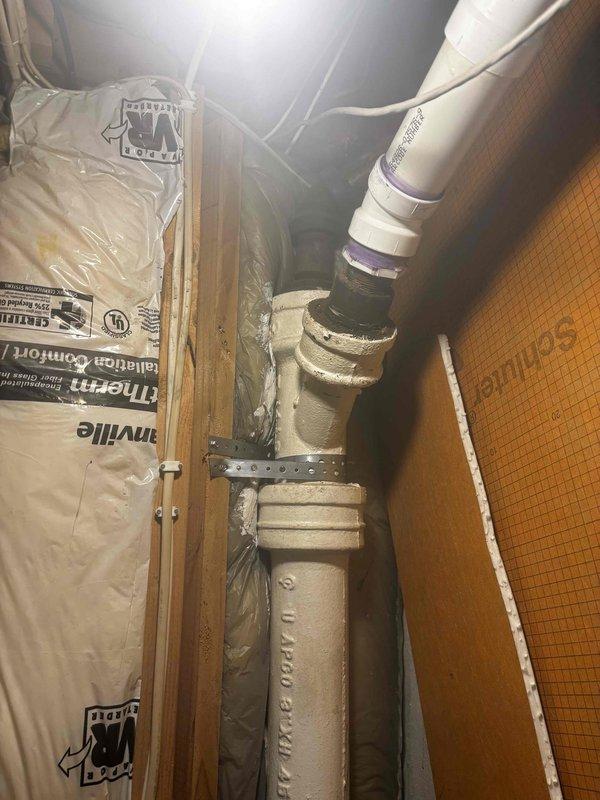 Successfully installed a 3" clean out and performed drain cleaning on 3" plumbing system in a confined wall space with exposed framing. Accessed and serviced pipes within the utility area that showed previous moisture issues, completing the quoted repair work as specified.
