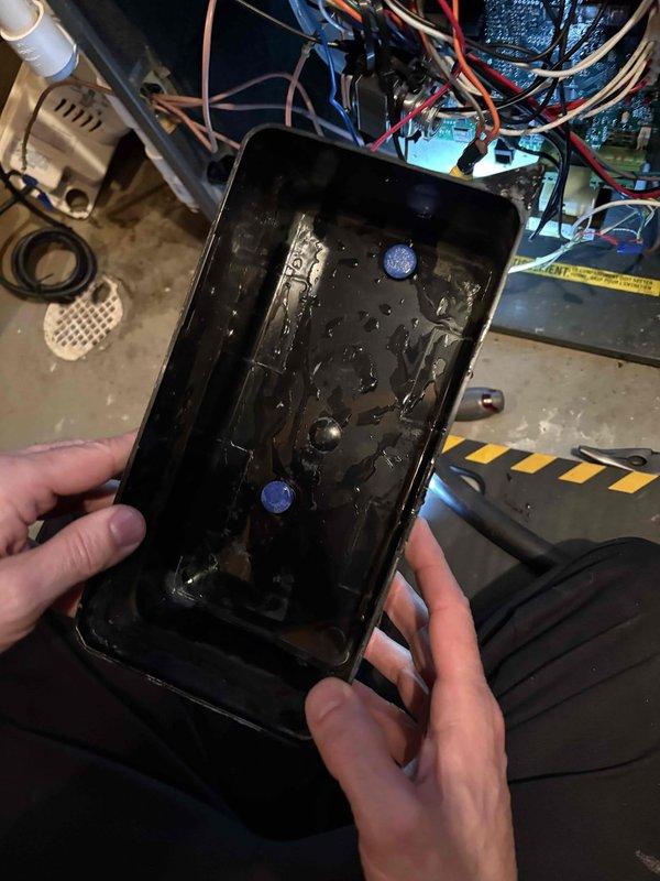Performed annual heating system maintenance including furnace tune-up with humidifier service. Removed and cleaned condensate collection tray which showed significant mineral buildup and debris accumulation. System was thoroughly inspected and restored to proper operating condition.