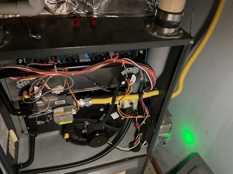 Completed annual heating tune-up on 12-year-old Amana furnace. Inspected internal components including electrical connections, blower assembly, and ductwork. System is operational with proper illumination of status indicators; no issues identified with the flexible gas line or insulated refrigerant piping.