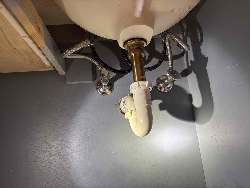 Completed quoted repair involving installation of two new regular height toilets on the upper level. Performed water filtration system service and various faucet repairs, including installation of a matte black kitchen faucet with dual handles and sprayer attachment. All plumbing connections were properly secured with no leaks observed during final inspection.