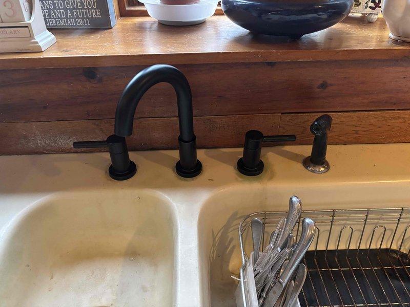 Completed quoted repair involving installation of two new regular height toilets on the upper level. Performed water filtration system service and various faucet repairs, including installation of a matte black kitchen faucet with dual handles and sprayer attachment. All plumbing connections were properly secured with no leaks observed during final inspection.