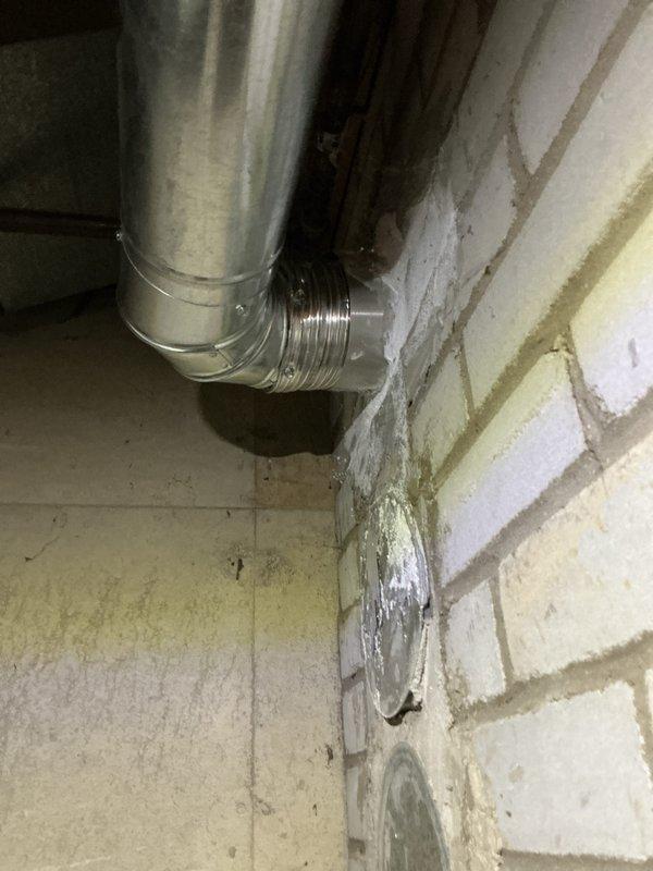 Performed annual heating maintenance on 13-year-old Goodman furnace and humidifier. Inspected water heater as requested by customer, noting significant deterioration and recommending replacement. Examined ductwork connections and venting system, confirming proper installation despite minor wall discoloration around vent penetrations.