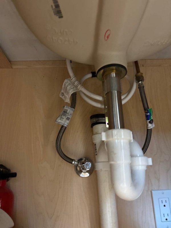 Successfully completed quoted repair involving disconnection of hot side handle assembly and installation of new hot end valve assembly while preserving the existing chrome faucet trim. Verified proper functionality of the newly installed components and confirmed no leaks in the plumbing system beneath the undermount sink.