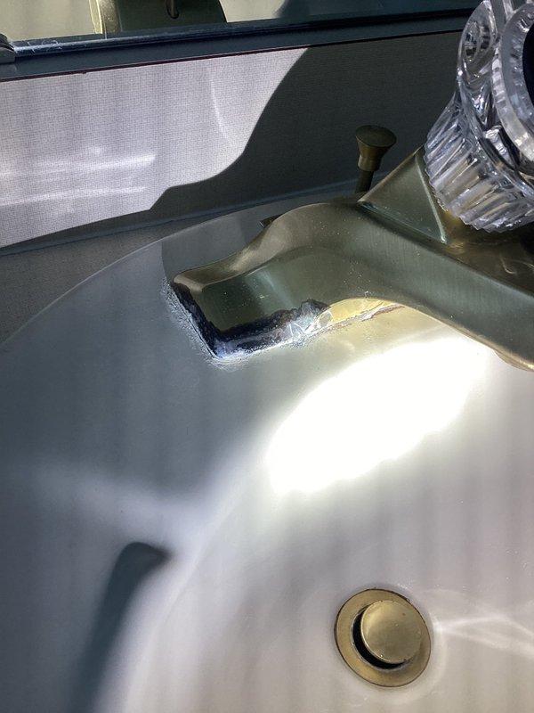 Conducted PCI-Plumbing Club Inspection on bathroom fixtures. Verified proper installation of dual water supply lines with shut-off valves and PVC drain pipe configuration. Noted minor mineral buildup at wall connection points and examined sink faucet assembly with transparent handle and brass drain stopper.