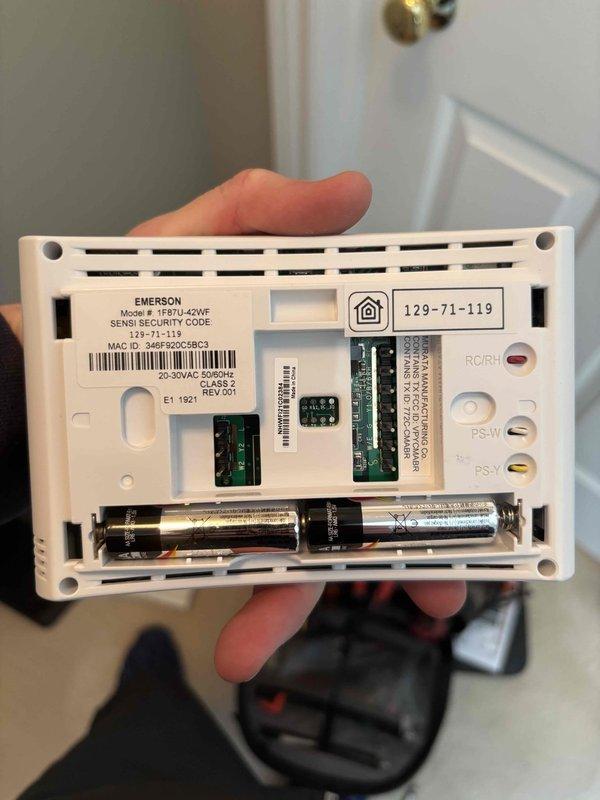 Completed annual maintenance on EnergiAir WT 11-2031 furnace and humidifier. Removed and inspected Emerson 1F87U-42WF thermostat, verifying proper connections and battery condition. Confirmed system operation with the Sensi digital thermostat showing proper temperature control (71°F room/72°F set) in heating mode.