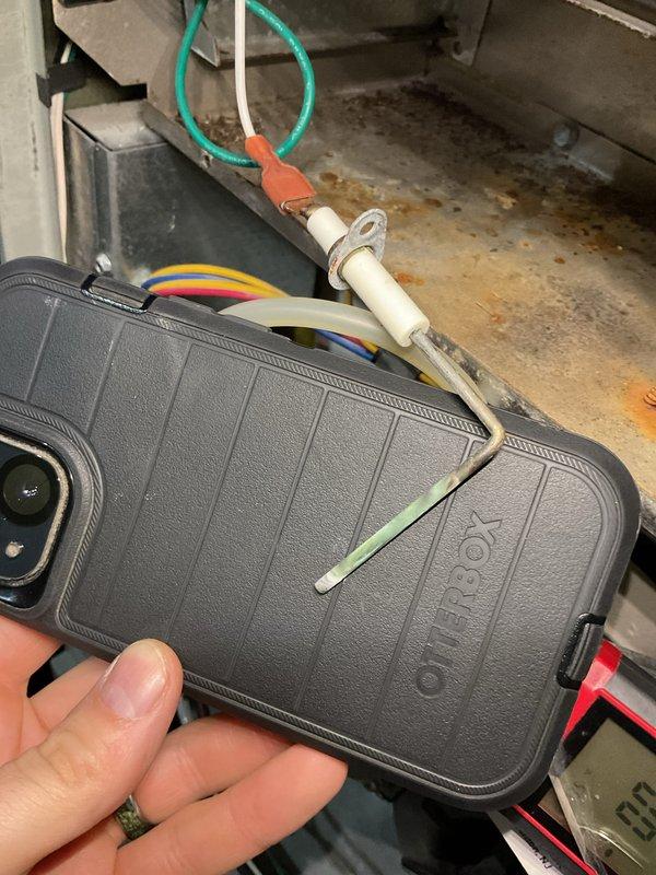 Performed annual heating maintenance on 11-year-old Trane furnace and humidifier. Documented existing corrosion and dust accumulation in system components. Identified loose connection clip requiring attention during inspection.