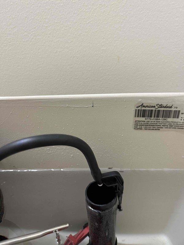 Performed diagnostic assessment on American Standard toilet installed in December that has required multiple service calls. Inspected internal tank components including flapper valve, fill valve, and flush mechanism. Documented ongoing issues with photographs for possible warranty replacement consideration.