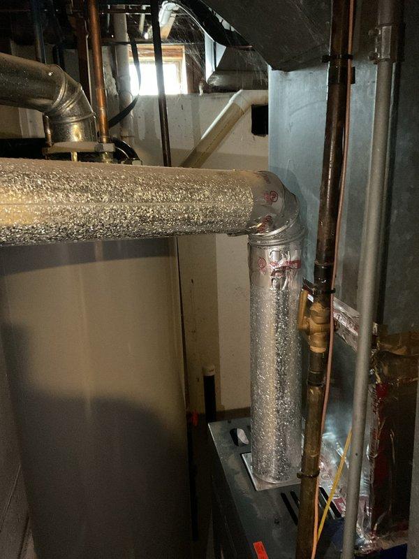 Responded to service call for water heater not heating to proper temperature. Upon inspection, discovered significant condensation on insulated ducts indicating temperature differential issues. Adjusted temperature settings and verified proper operation of heating elements, restoring normal functionality to the water heater system.