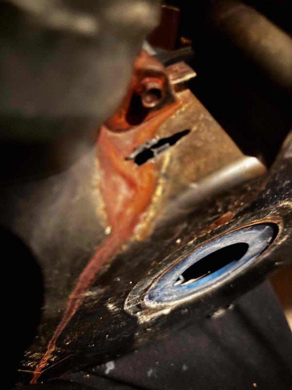 Picked up necessary parts for the quoted repair job involving a furnace inducer motor replacement. Identified significant corrosion on the existing inducer motor assembly with visible oxidation on copper components and rust streaks indicating moisture exposure. Work will continue when technician returns to complete the inducer motor installation as scheduled.