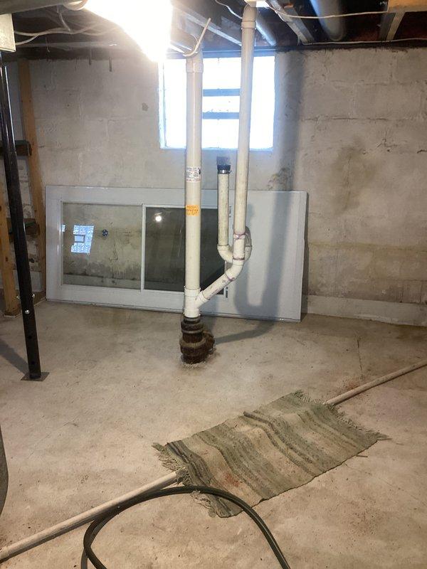 Conducted site assessment for washer/dryer hookup installation in unfinished basement. Evaluated existing plumbing infrastructure, including PVC drain stack and copper supply lines. Documented current conditions of concrete floor, exposed ceiling joists, and HVAC ductwork to determine optimal connection points and installation requirements for new laundry facilities.