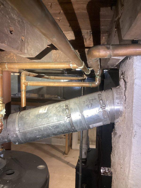 Conducted site assessment for washer/dryer hookup installation in unfinished basement. Evaluated existing plumbing infrastructure, including PVC drain stack and copper supply lines. Documented current conditions of concrete floor, exposed ceiling joists, and HVAC ductwork to determine optimal connection points and installation requirements for new laundry facilities.