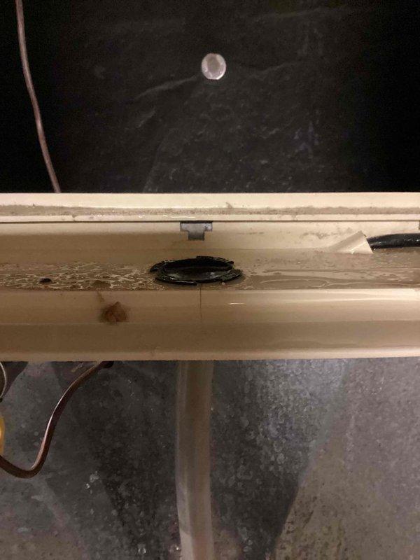 Responded to service call for water leakage from humidifier. Inspection revealed severely clogged air filter restricting proper airflow and water drainage issues at the humidifier drain port with visible staining indicating ongoing leakage. Replaced filter, cleaned drainage components, and verified proper system operation before completing service.