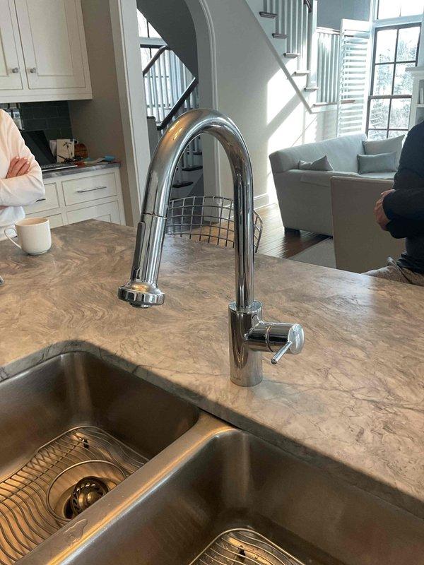 Inspected toilet mechanism and identified a worn flapper valve causing intermittent leaking; replaced flapper to restore proper tank function. Repaired kitchen faucet by replacing cartridge and O-rings, eliminating leak at base of handle while ensuring proper water flow and pressure.