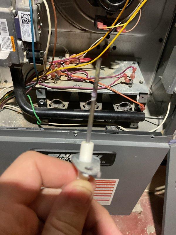 Responded to no heat call for 8-year-old ENE WT furnace with flame sensor error code causing lockout. Removed burner assembly to access and clean flame sensor with emery cloth, then reinstalled components and verified proper ignition sequence. Unit now operating normally with strong flame signal and no fault codes.