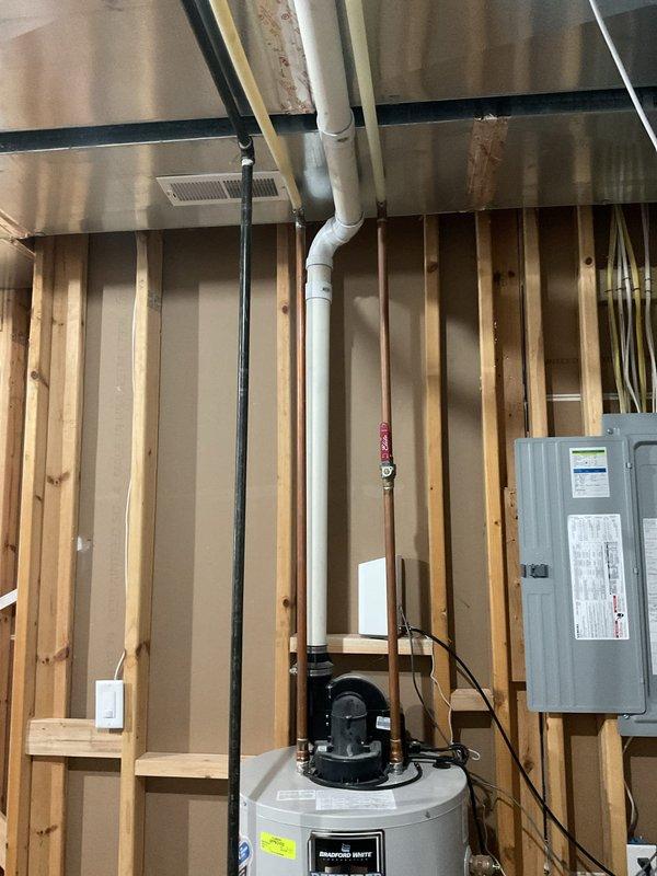 Performed diagnostic inspection on kitchen drain system due to reported gurgling when dishwasher runs. Identified and cleared minor obstruction in drain line that was causing air displacement and gurgling noise. Additionally, conducted preventative maintenance on sump pump system that was cycling frequently and performed standard water heater tune-up service, including temperature check, pressure relief valve test, and inspection of connections.