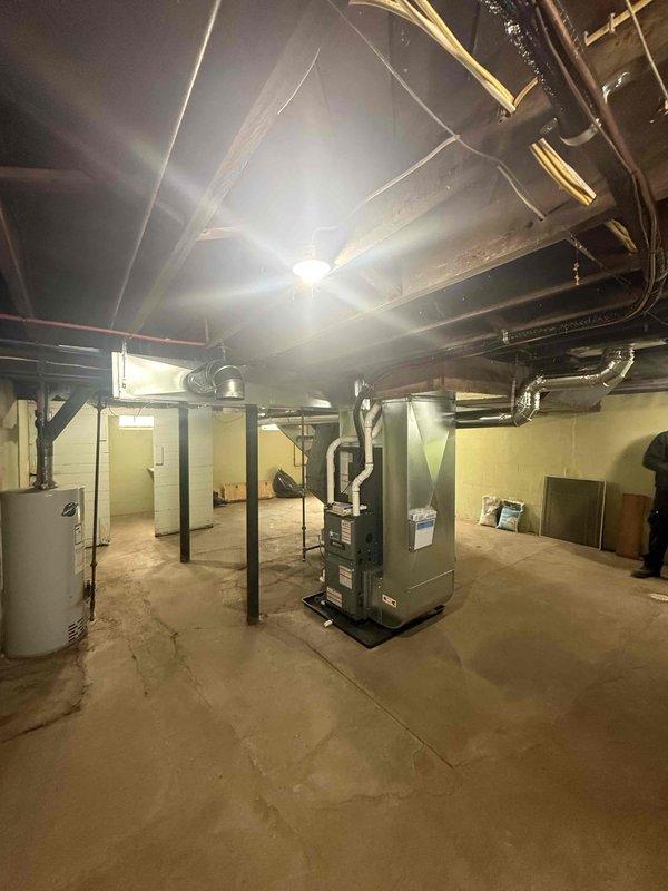 Successfully completed installation of new residential HVAC system, consisting of a high-efficiency furnace and addition of AC components. System was properly mounted in basement utility area with all necessary ductwork connections, electrical wiring, and condensate drainage established to ensure optimal performance and code compliance.