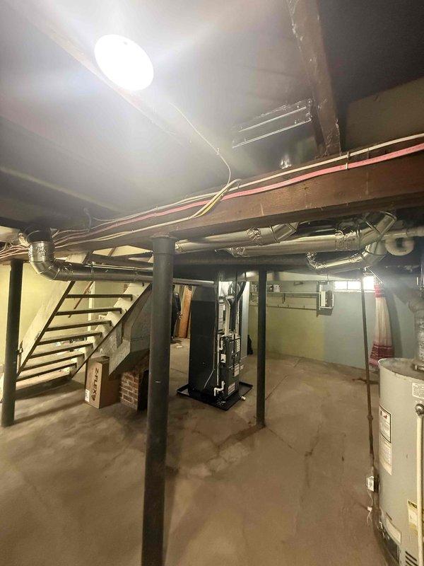Successfully completed installation of new residential HVAC system, consisting of a high-efficiency furnace and addition of AC components. System was properly mounted in basement utility area with all necessary ductwork connections, electrical wiring, and condensate drainage established to ensure optimal performance and code compliance.