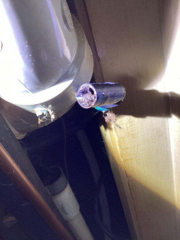 Diagnosed recurring no heat issue on 17-year-old Energi furnace. Discovered damaged blue cylindrical component with visible interior damage at connection point. Observed wear and possible corrosion on metal fixtures within the aging system, likely contributing to the repeated service calls for the same problem.