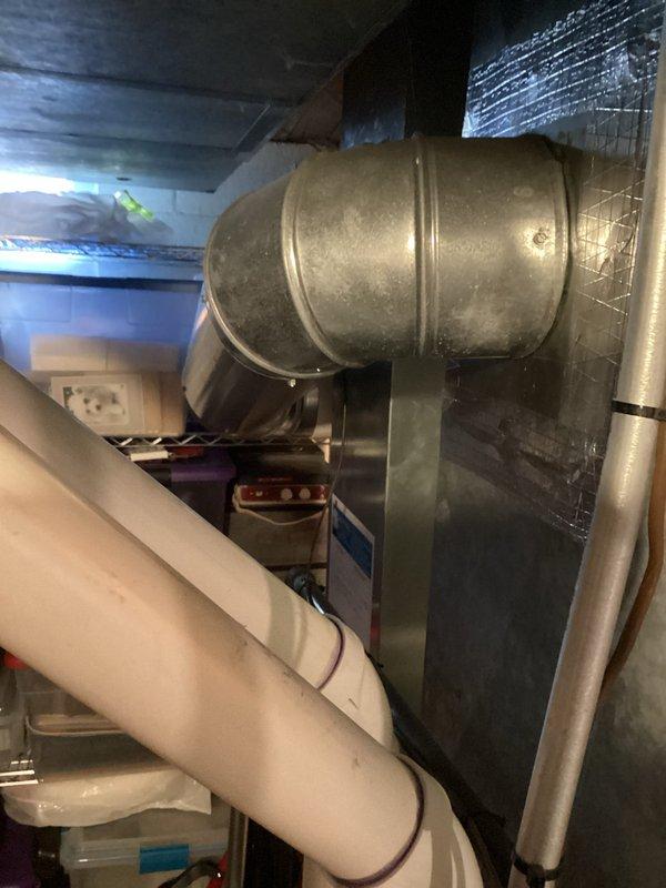 Investigated water leak concern around 12-year-old Tempstar furnace. Upon inspection, determined condensate drain line was properly functioning with dry drain pan. Examined HVAC ductwork and PVC drainage system to verify no active leaks or moisture issues.