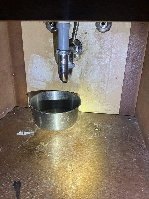 Installed new shut-off valves for sink faucet that was previously lacking isolation capability. Accessed plumbing through ceiling access panel to complete connection to main supply lines. Verified proper operation with no leaks at new valve connections.