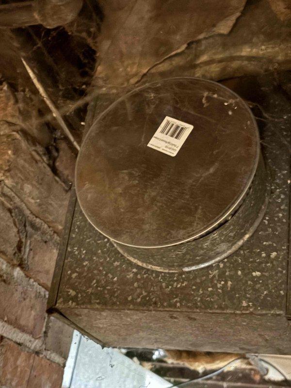 Inspected 16-year-old furnace system in lower unit of duplex home that was only heating to 65°F despite owner's replacement of capacitor, thermostat, high limit switch, and filter. Examination of attic ductwork revealed significant air leakage at connections. Sealed duct joints and recalibrated system, restoring proper heating function to desired temperature.