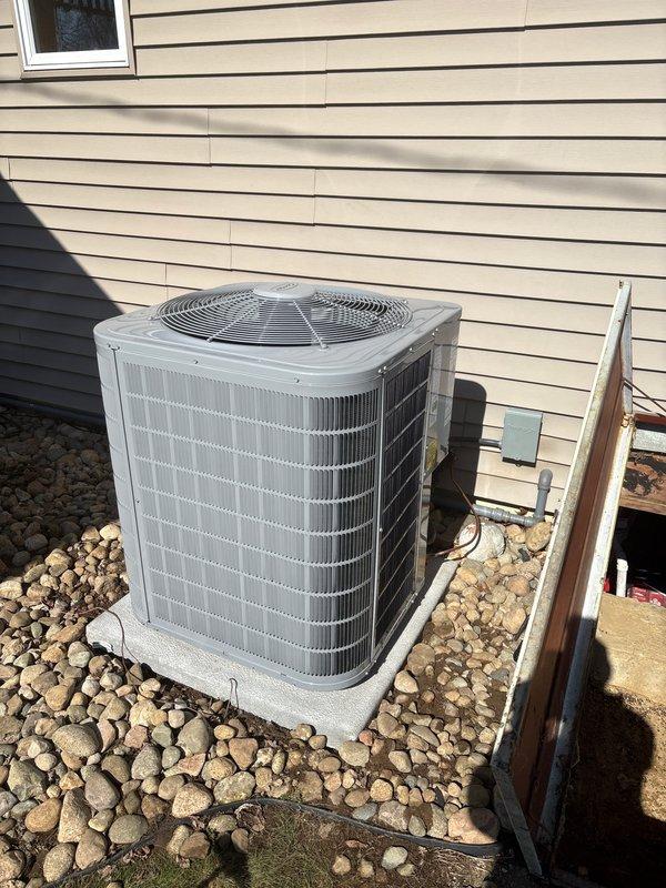 Successfully completed installation of new Carrier furnace system with dual PVC exhaust venting and accompanying outdoor AC condenser unit. The furnace was properly connected to existing ductwork with all necessary electrical components installed to manufacturer specifications. Exterior condenser was positioned on concrete pad with appropriate clearance for optimal airflow and connected to the home's electrical system via disconnect switch.