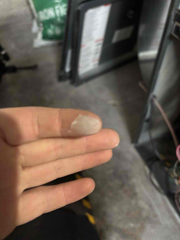 Responded to home with post-fire restoration concerns regarding HVAC system making vibration noise, loud bangs during cycling, and insufficient heating. Inspected blower wheel assembly and found foreign debris adhered to wheel causing imbalance. Removed debris, tested system operation, and verified proper temperature rise and quiet operation after service.