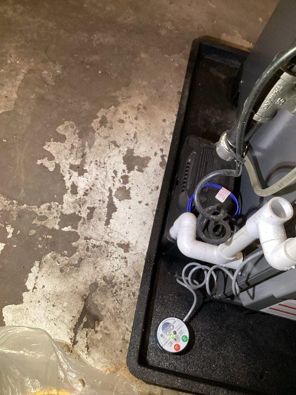 Completed annual inspection on 1-2 year old EnergiAir furnace. Inspected condensate pump system in basement, noting proper operation with no issues. Documented installation with photos showing the drainage system and containment tray functioning as designed. System is in good working order with warranty valid until 2027.