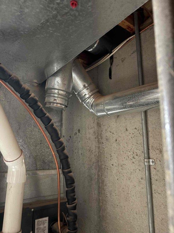 Responded to service call for 14-year-old Bradford water heater with complaint of very little hot water. Upon inspection, found significant sediment buildup restricting heat transfer efficiency. Flushed system to remove accumulated sediment and verified proper venting configuration, restoring normal hot water supply and function.