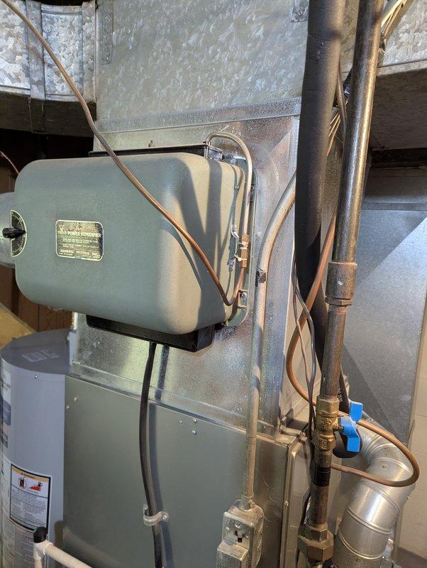 Successfully installed a 40-gallon natural gas water heater with short configuration. Connected all necessary copper supply lines with appropriate brass fittings and installed proper ventilation ductwork with metal clamps to ensure safe operation. Verified all connections were secure and system was functioning correctly before completion.