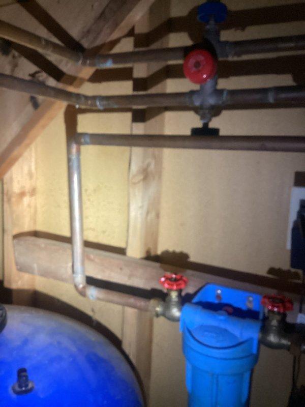 Successfully repaired pinhole leak in basement copper pipe near whole house filtration system. Replaced worn valves on the whole house filter unit to ensure proper function and prevent future leakage. System was pressure tested after repair to confirm integrity of the plumbing network.