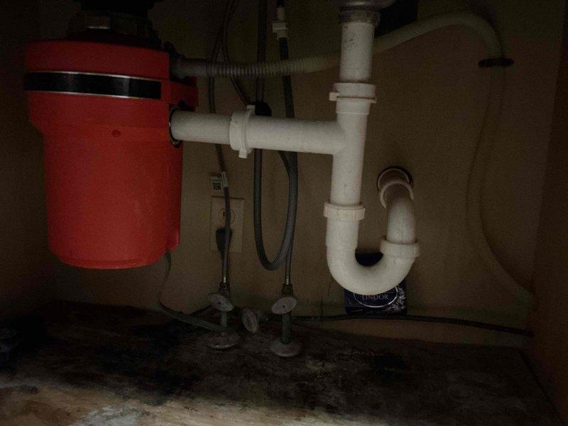 Cleared kitchen sink drain blockage at U-joint, removing accumulated debris and restoring proper drainage. Inspected upstairs bathroom faucet drip issue, diagnosed worn cartridge requiring replacement to eliminate leakage.