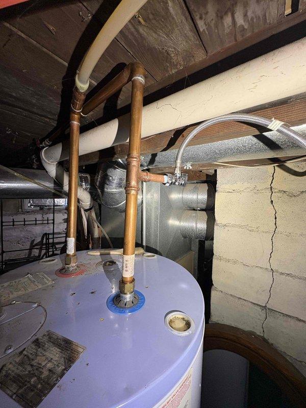Successfully installed a new water line for refrigerator, connecting from the existing residential plumbing system. Work included routing copper piping through utility area near water heater, ensuring proper fittings and connections to prevent leaks. Tested the installation to verify proper water flow and pressure to the refrigerator.