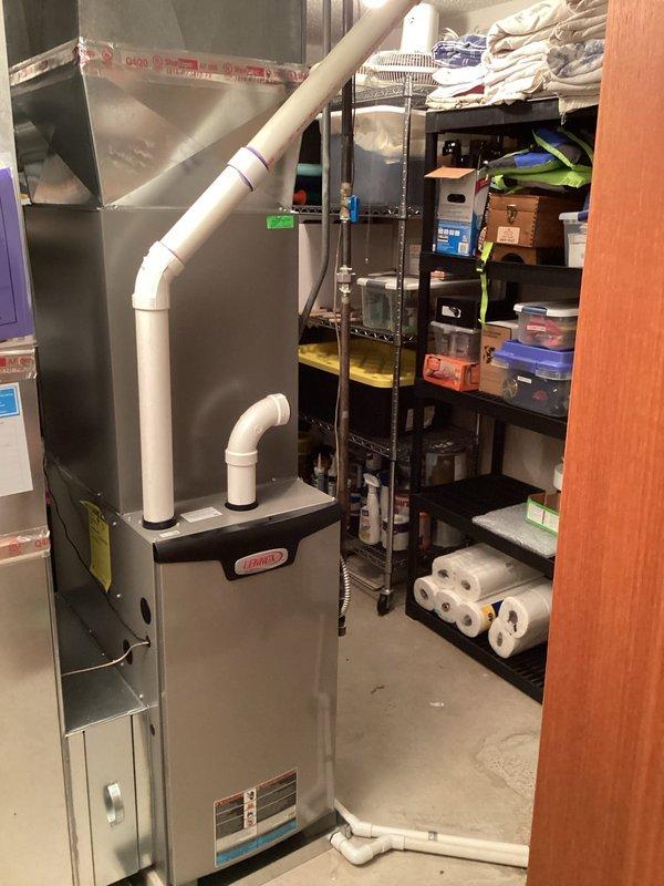Conducted site visit for water softener estimate; documented existing utility room setup including Lennox furnace system and electrical panel configuration. Left voicemail with customer; test results and pricing information to be provided by sales representative.