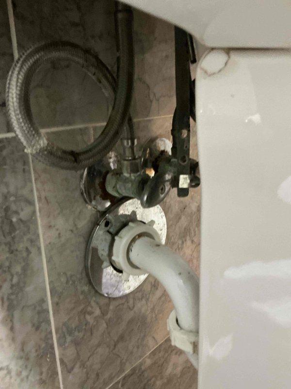 Responded to call regarding plumbing fixture maintenance. Serviced wall-mounted shutoff valve with connected PVC drainage system in bathroom. Inspected supply lines and connections at pedestal sink for proper function and verified no leaks present in the system.