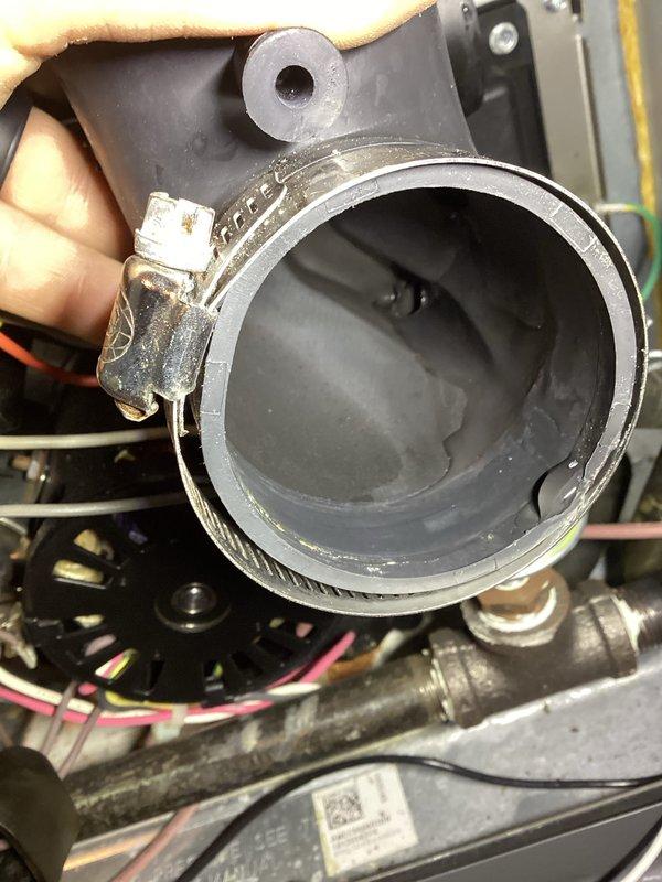 Performed routine annual heating maintenance on furnace and humidifier per service agreement. Discovered water accumulation in the humidifier base tray requiring drainage. Inspected and adjusted hose connection with clamp to resolve leak issue and ensure proper system operation.