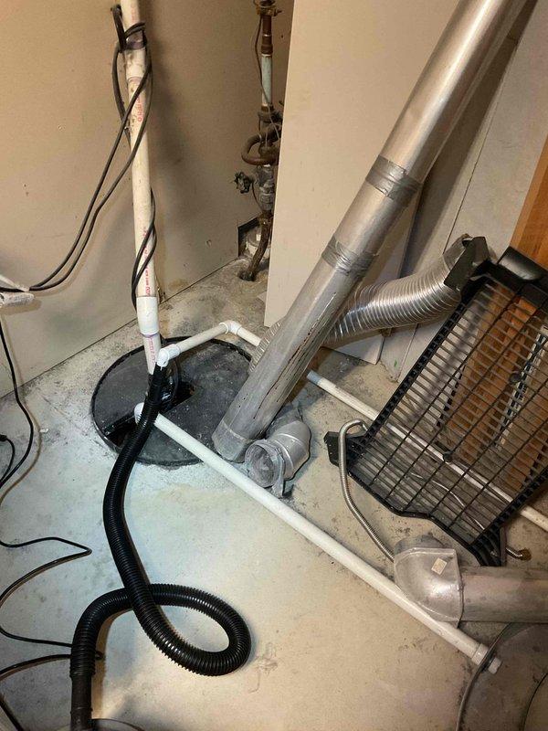 Performed annual heating tune-up on 9-year-old ENE system with humidifier. Verified level installation of HVAC components and inspected sump pump system with proper discharge piping. Checked ductwork connections and heat exchanger components; all systems functioning properly.