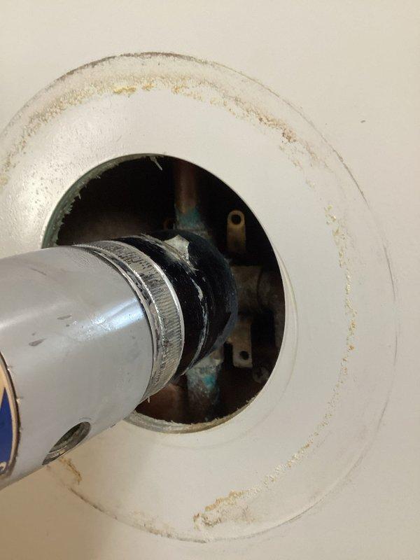 Conducted assessment of bathroom shower components requiring replacement. Observed significant mineral buildup and wear on existing chrome shower head, spout and dial assembly. Internal plumbing connections showed signs of corrosion within wall cavity. Documented condition with photos to develop comprehensive replacement estimate for all affected components.