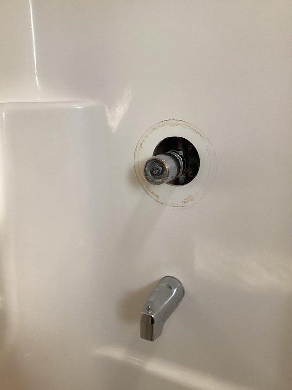 Conducted assessment of bathroom shower components requiring replacement. Observed significant mineral buildup and wear on existing chrome shower head, spout and dial assembly. Internal plumbing connections showed signs of corrosion within wall cavity. Documented condition with photos to develop comprehensive replacement estimate for all affected components.