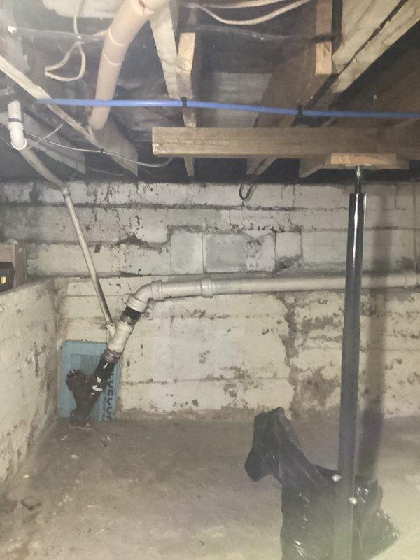 Conducted thorough inspection of century-old sewer system in unfinished basement area, documenting deteriorated cast iron drain lines and compromised pipe connections. Provided comprehensive estimate for complete sewer pipe replacement with code-compliant PVC materials, including necessary wall penetrations and proper connection to main sewer line.