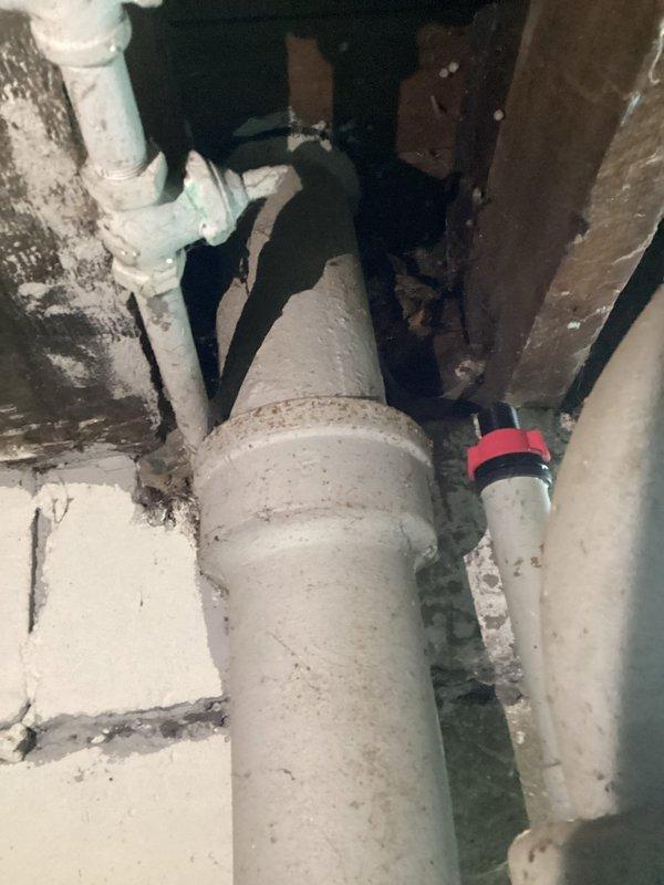 Conducted thorough inspection of century-old sewer system in unfinished basement area, documenting deteriorated cast iron drain lines and compromised pipe connections. Provided comprehensive estimate for complete sewer pipe replacement with code-compliant PVC materials, including necessary wall penetrations and proper connection to main sewer line.