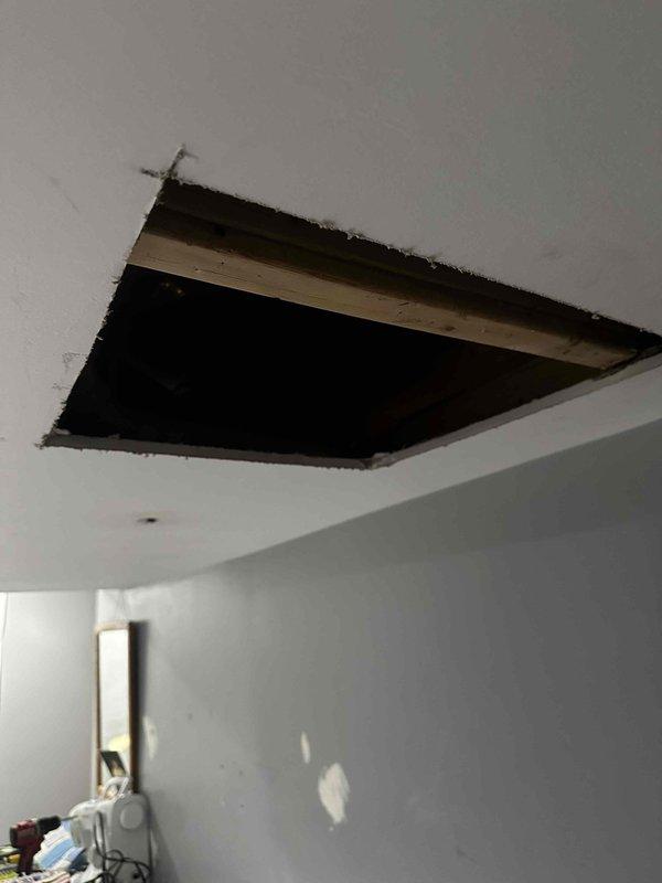 Performed annual maintenance on 11-year-old RUUD furnace. Accessed system through ceiling panel for inspection. Identified and documented plumbing issue with PVC pipe joint (highlighted in photo) that requires attention. System was manufactured in 2023 and is operating without humidity control issues.