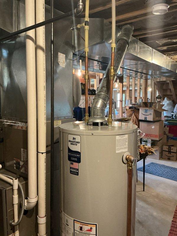 Performed diagnostic assessment on 50-gallon Bradford White water heater exhibiting leakage. Inspected thermostat panel and tank seams, identified source of leak, and implemented necessary repairs to resolve the water leakage issue.