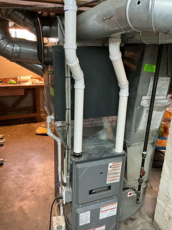 Performed estimate assessment on AC unit that sustained impact damage from falling ice. Visual inspection of the existing HVAC system revealed a damaged outdoor condenser unit requiring replacement. Documented the current installation configuration including furnace connections, ductwork, and drainage systems to ensure proper sizing for replacement equipment.