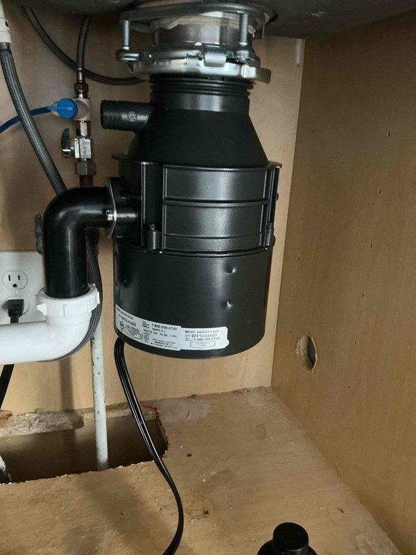 Replaced faulty garbage disposal unit under kitchen sink. Installed new InSinkErator model with proper electrical and plumbing connections. System tested and verified operational with no leaks.