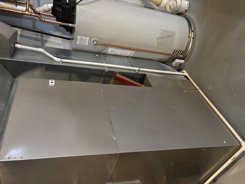 Performed quoted repair on 17-year-old Carrier furnace, replacing inducer and adding insulation to protect exhaust from floor joists. Inspected plumbing system with expansion tank and water heater installation, confirming proper connections and functionality of copper and PVC piping components.