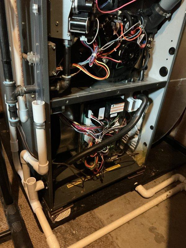 Completed annual heating service on furnace system. Inspected internal components including electrical connections, circuit boards, and drainage system - all found to be in working order with normal dust accumulation. Verified proper installation of PVC venting and condensate lines with no issues identified.