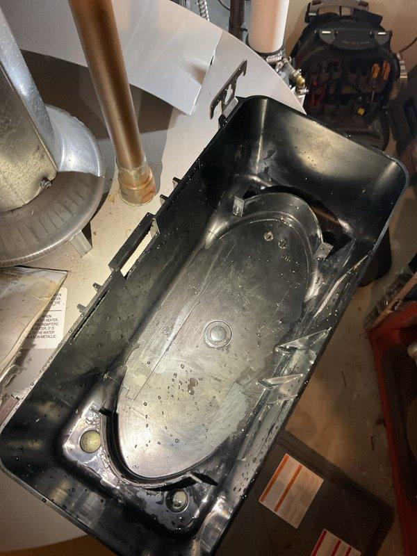 Performed annual heating system maintenance on EnergiAir furnace (2014 model) with attached humidifier. Inspection revealed significant mineral buildup and moisture accumulation in the drain pan. Cleaned condensate collection system, checked copper line connections, and restored proper drainage function to prevent potential water damage and ensure efficient system operation.