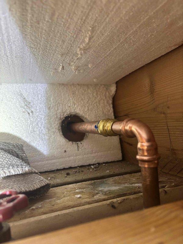 Identified and repaired a leaking outdoor spigot that was causing water infiltration into the home. Inspection revealed compromised copper pipe fittings at the 90-degree elbow connection, which were replaced along with the damaged brass valve assembly to restore proper function and prevent further water damage to the interior structure.