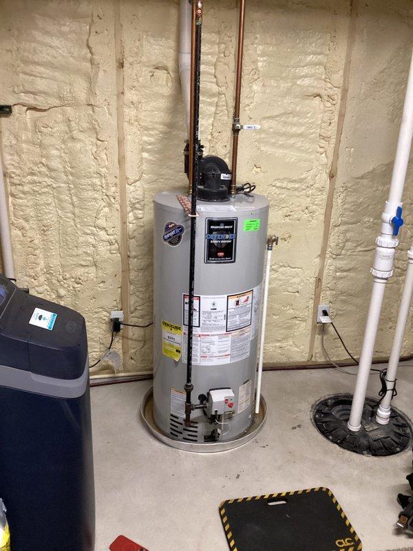 Responded to service call for a 6-year-old Bradford White water heater that was leaking from the bottom and not producing hot water. Upon inspection, determined the unit had a tank failure requiring full replacement. Installed new water heater, connected to existing copper supply lines and PVC drain, and verified proper operation before completing service.